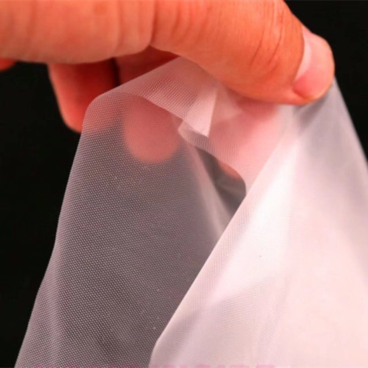 Guantes de TPE blanquecinos, suaves y respetuosos con el medio ambiente (patrón de rombos)